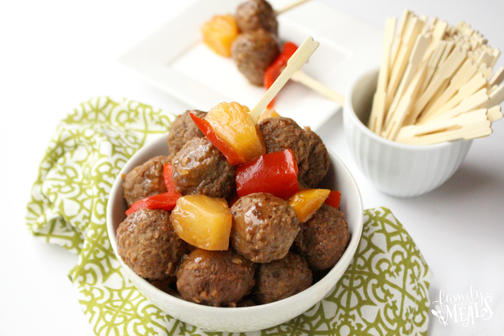 Sweet and Sour Crockpot Meatballs in a bowl, with a side bowl of food picks