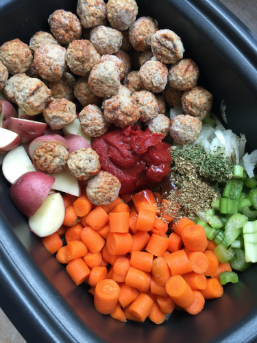 Frozen Meatballs, potatoes, carrots, celery, onion, seasoning, tomato paste in a Slow Cooker