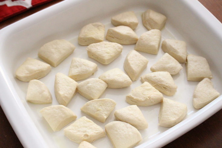 Biscuits and Gravy Breakfast Casserole - refrigerated biscuit pieces placed in casserole dish