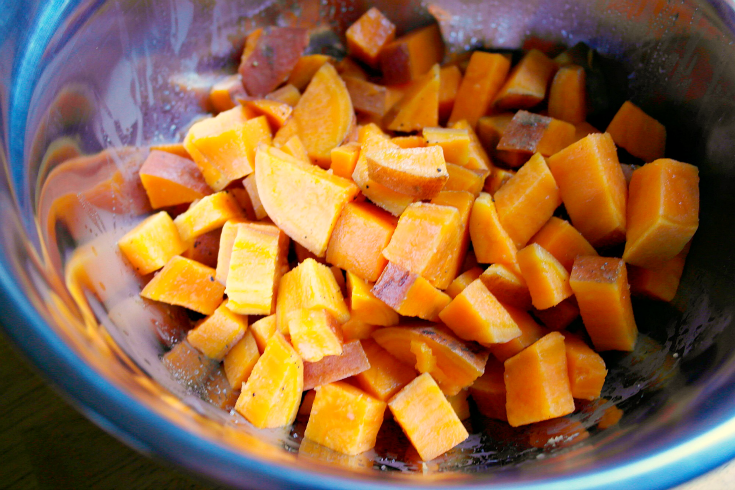 diced sweet potatoes in a mixing bowl