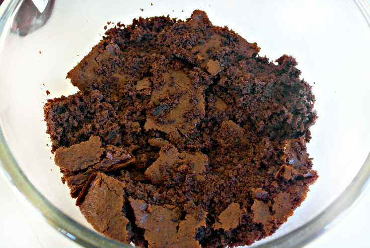 Chocolate cake crumbled in bowl