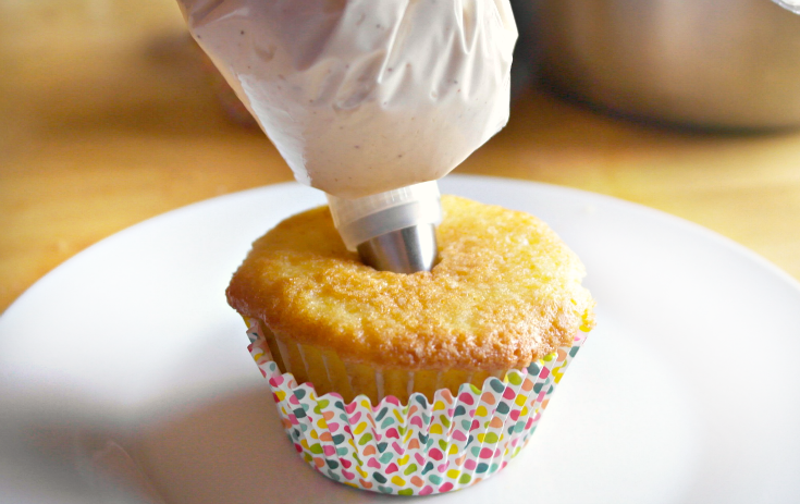 filling cupcake with cream filling