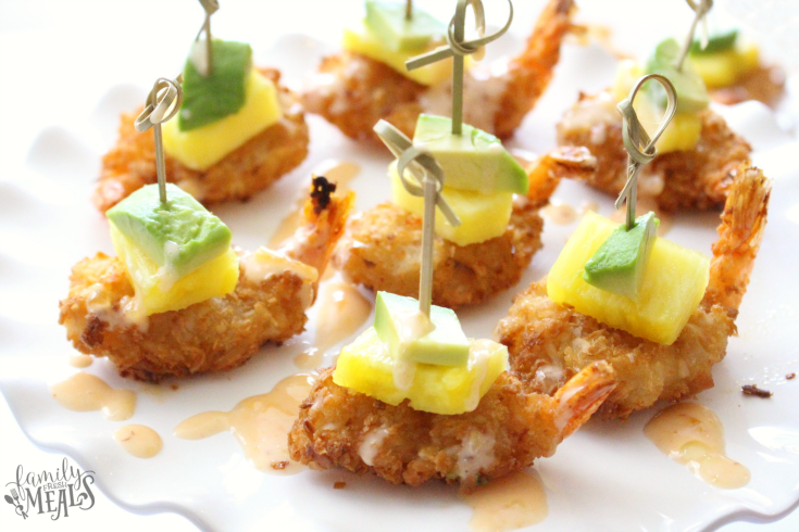 Tropical coconut shrimp bites on a platter with food picks