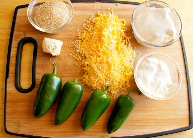 Ingredients for Jalapeno Popper Dip on a cutting board