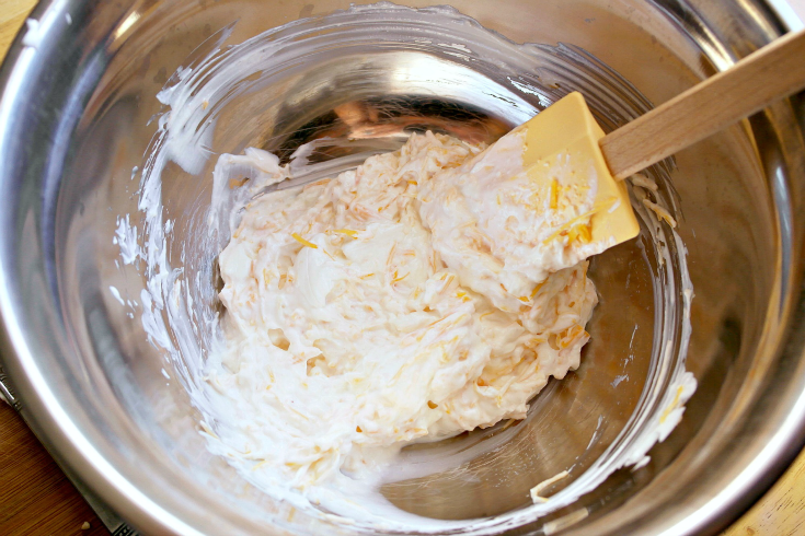 cream cheese and sour cream in a mixing bowl