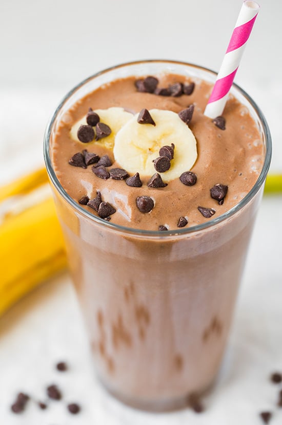 Chocolate Peanut Butter Banana Smoothie topped with mini chocolate chips and banana slice