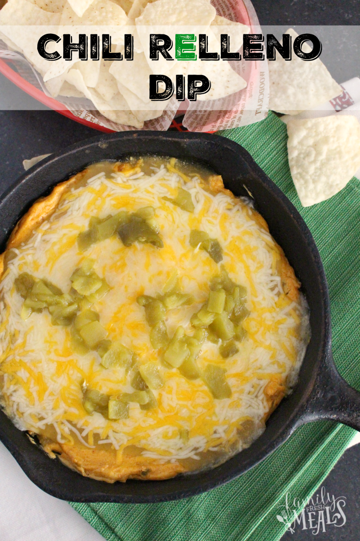 Chili Relleno Dip in a cast iron pan, with a side of chips