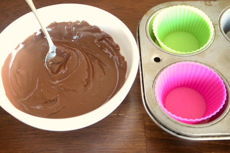 mixing melted chocolate in a bowl with a spoon