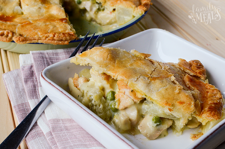 Slice of the Best Homemade Chicken Pot Pie on a white plate