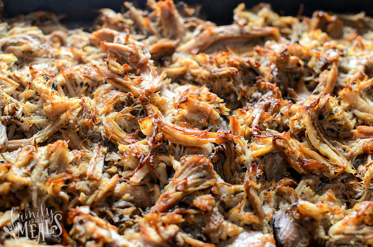 Crockpot Pork Carnitas - Easy crockpot pork recipe - Pork Meat browned on a baking sheet.