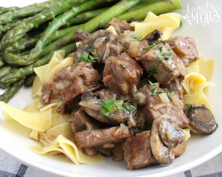 Easy Crockpot Beef Burgundy - Slow cooker beef and mushrooms served on a plate