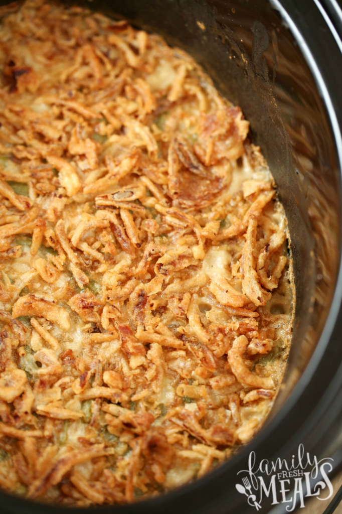 Crockpot Green Bean Casserole cooked in a slow cooker and topped with french onions - Family Fresh Meals