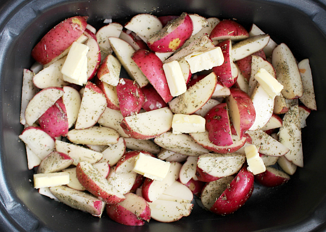 Crockpot Parmesan Potato Wedges - Place sliced potato wedges, seasoning and butter into slow cooker