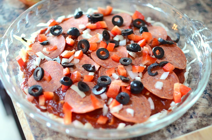 Easy Pizza Dip Recipe - pepperoni, olives, peppers and onion placed on top