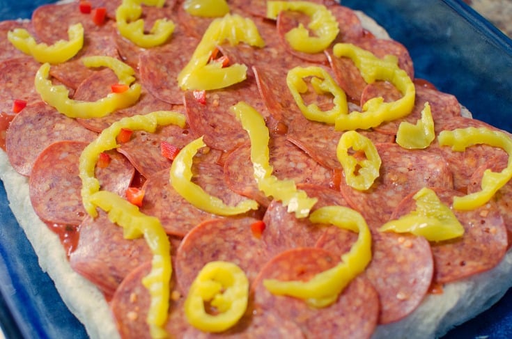 pepper slices added to top of pepperoni