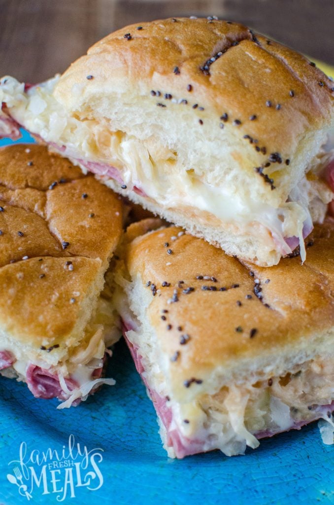 Reuben Sliders Recipe stacked on a blue plate