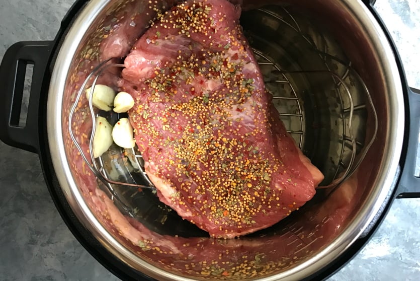 Instant Pot Corned Beef and Cabbage - Corned beef in instant pot with seasons
