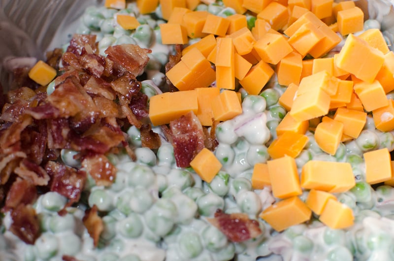 Creamy Bacon Pea Salad - mixing in bacon, and cheese to pea salad