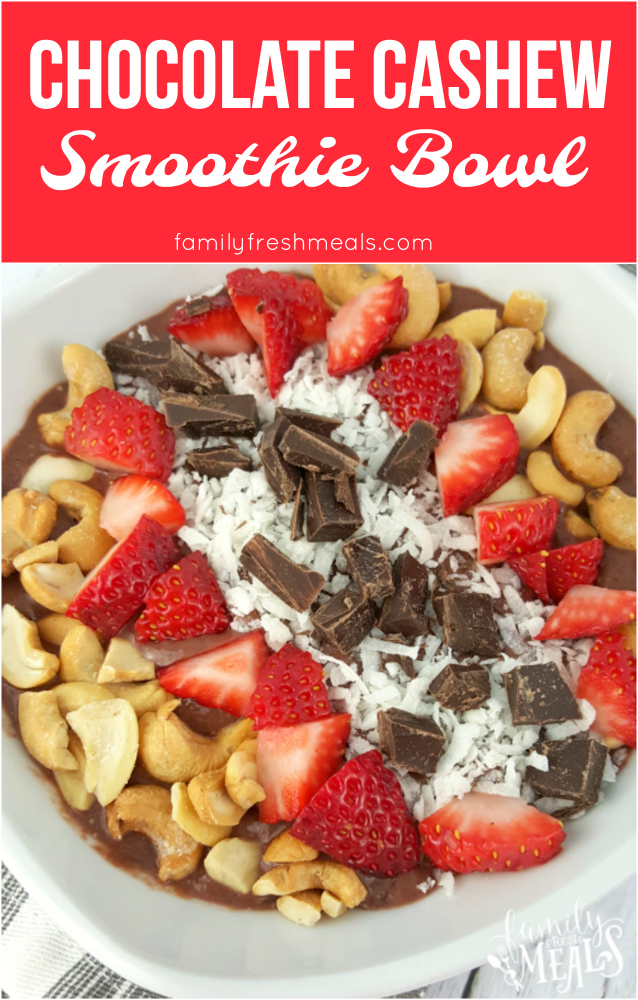 This Chocolate Cashew Smoothie Bowl is topped with fresh strawberries, cashews, and coconut. Chocolate lover? Add some dark chocolate! via @familyfresh