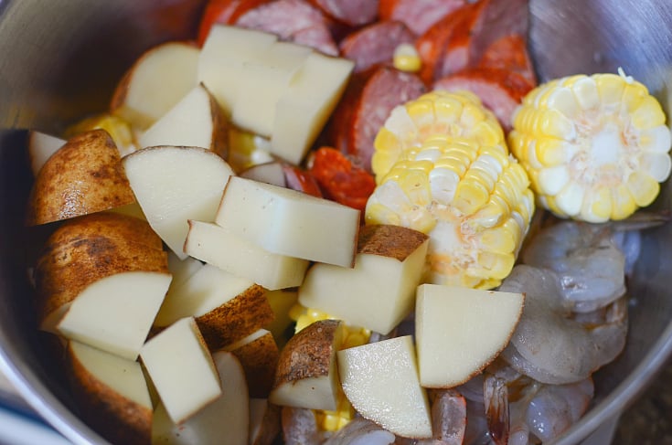 Shrimp and Sausage Foil Packets - potatoes, corn, sausage and shrimp in a bowl