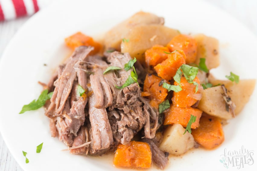 Set it Forget it Easy Crockpot Recipes - Easy Crockpot Pot Roast served on a white plate