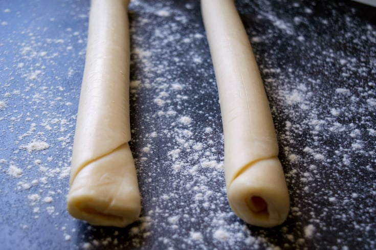 Meat Lovers Breakfast Bake Slab - rolled up pie crust on a floured surface