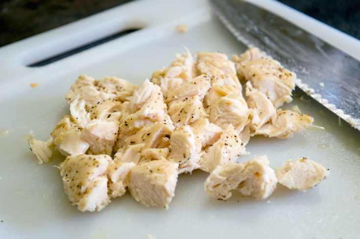 Buffalo Chicken Bites - Chopped baked chicken on cutting board