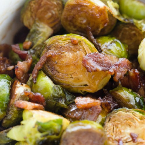 Honey Bacon Brussels Sprouts served in a bowl and topped with bacon