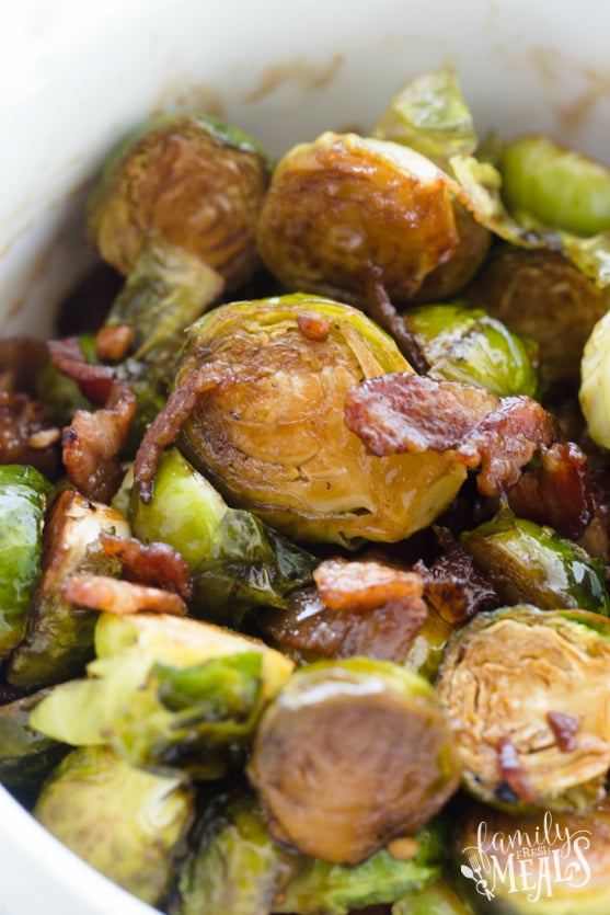 Honey Bacon Brussels Sprouts served in a bowl and topped with bacon