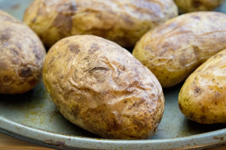 Loaded Thanksgiving Leftover Baked Potatoes - Potatoes on baking sheet