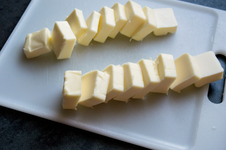 Andes Chocolate Toffee Bark - tabs of butter on cutting board