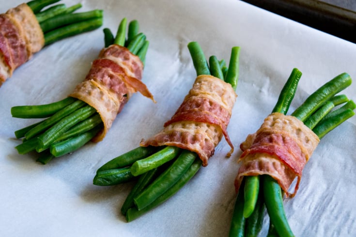 Bacon Wrapped Green Bean Bundles - Fresh Beans wrapped in bacon on baking sheet