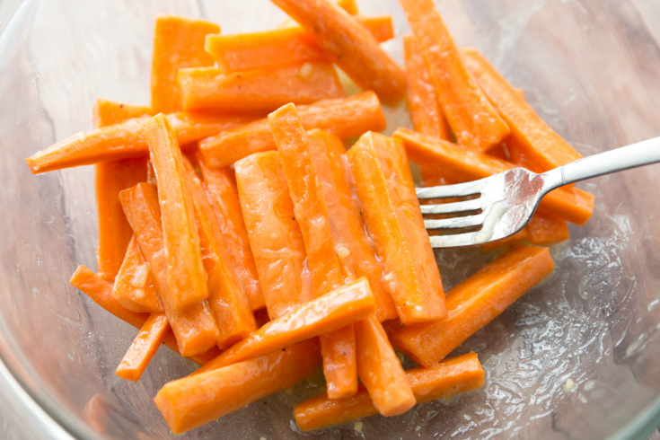 Honey Garlic Roasted Carrots - Carrots in bowl with butter and garlic