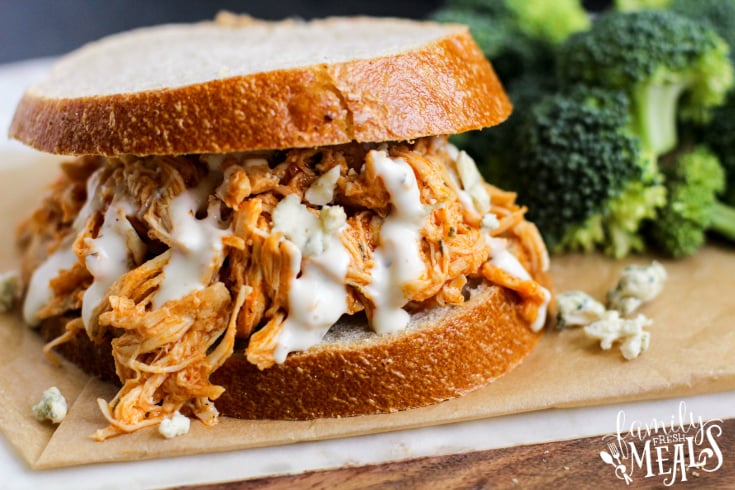 Crockpot Buffalo Chicken Sandwiches - A family favorite sandwich topped with dressing and cheese - Family Fresh Meals