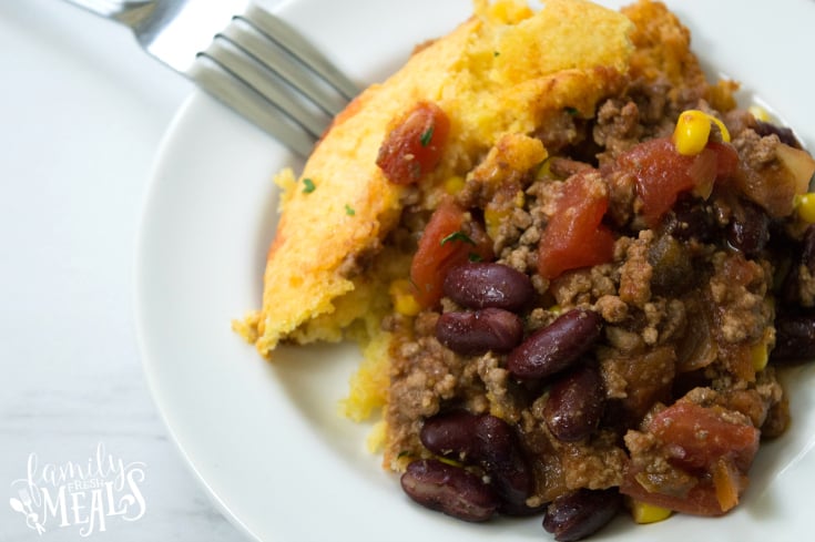 Chili Stuffed Cornbread Casserole - Cassrole served on a white plate