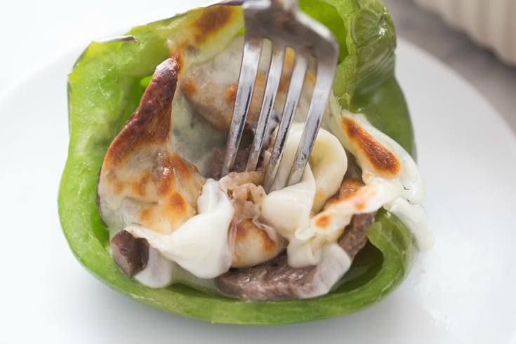 Philly Cheese Steak Stuffed Peppers - Fork cutting into stuffed pepper