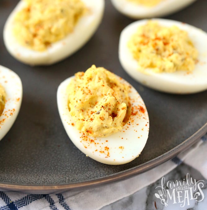 Blue Ribbon Deviled Eggs - Deviled eggs served on a plate, topped with seasoning