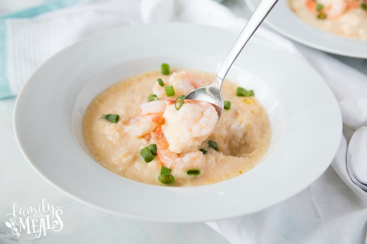 Crockpot Cheesy Grits and Shrimp served in a white bowl