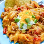 Instant Pot Taco Pasta - Taco past served on a blue plate. Family Fresh Meals