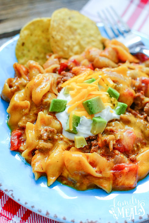 Instant Pot Taco Pasta - Taco past served on a blue plate. Family Fresh Meals