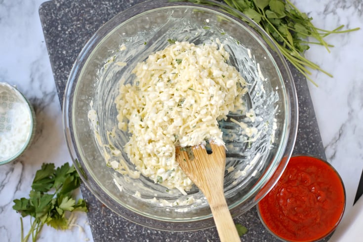 Cheesy Lasagna Rolls - Cheeses mixed in a glass bowl