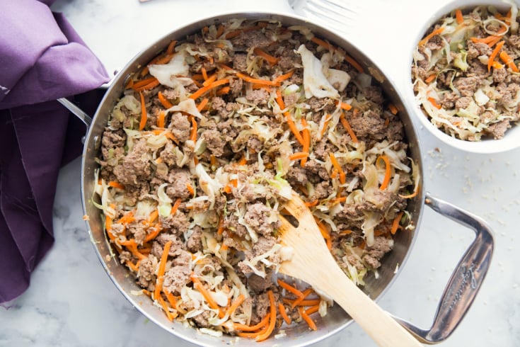 Healthy Egg Roll Stir Fry - Served in a pan and in a small white bowl