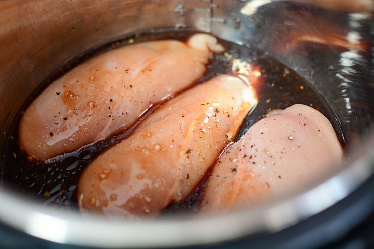 Instant Pot Honey Garlic Chicken - Chicken in instant pot with sauce