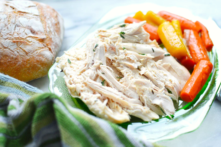 How to Make an Instant Pot Whole Chicken - Chicken served on a plate with carrots