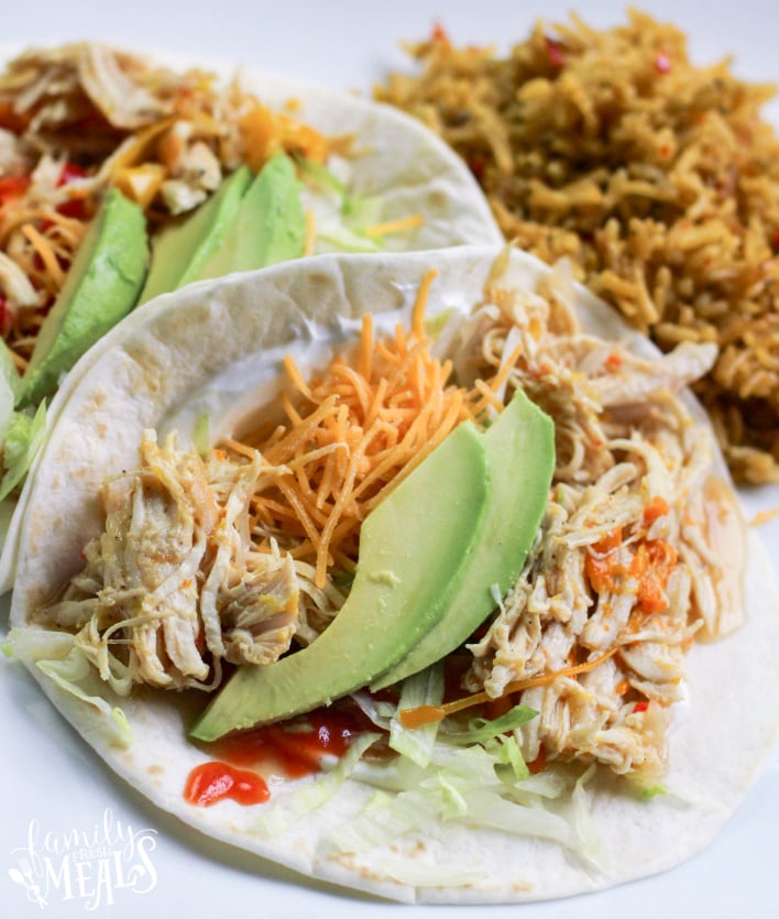 Instant Pot Chicken Fajitas - Chicken fajitas and rice served on a white plate