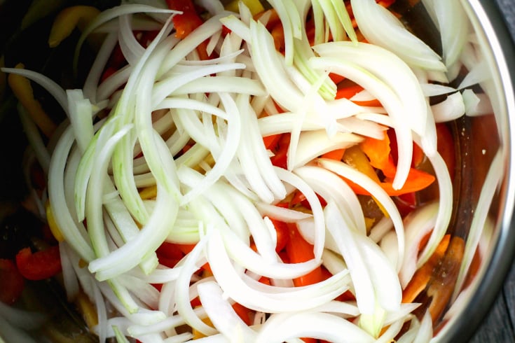 Instant Pot Chicken Fajitas - Sliced onions in Instant Pot