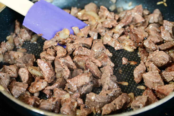 Beef Stroganoff Casserole - Cubed beef cooking in a pan