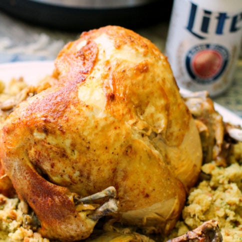 Instant Pot Beer Can Chicken - Beer Can Chicken served on a plate with stuffing