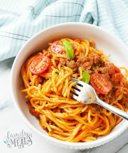 Instant Pot Spaghetti dinner - spaghetti instant pot Served in a white bowl with fork - Family Fresh Meals