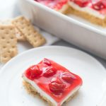 No Bake Cherry Cheesecake Dessert Recipe - Family Fresh Meals Slice of dessert on a white plate